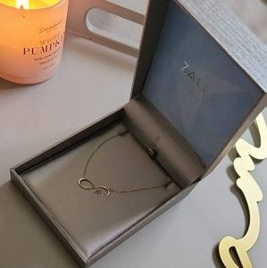 Zales: Gold infinite love necklace